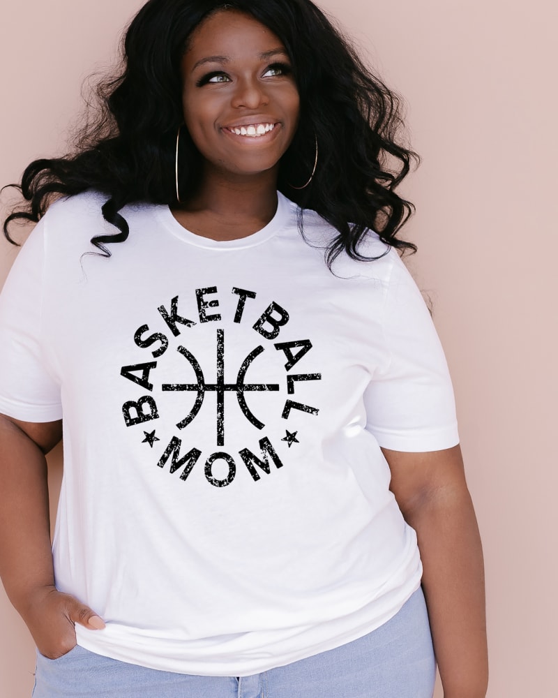 Front of a model wearing a size XL Basketball Mom Distressed Short Sleeve Graphic Tee in Hue by Simply Sage Market. | dia_product_style_image_id:294017